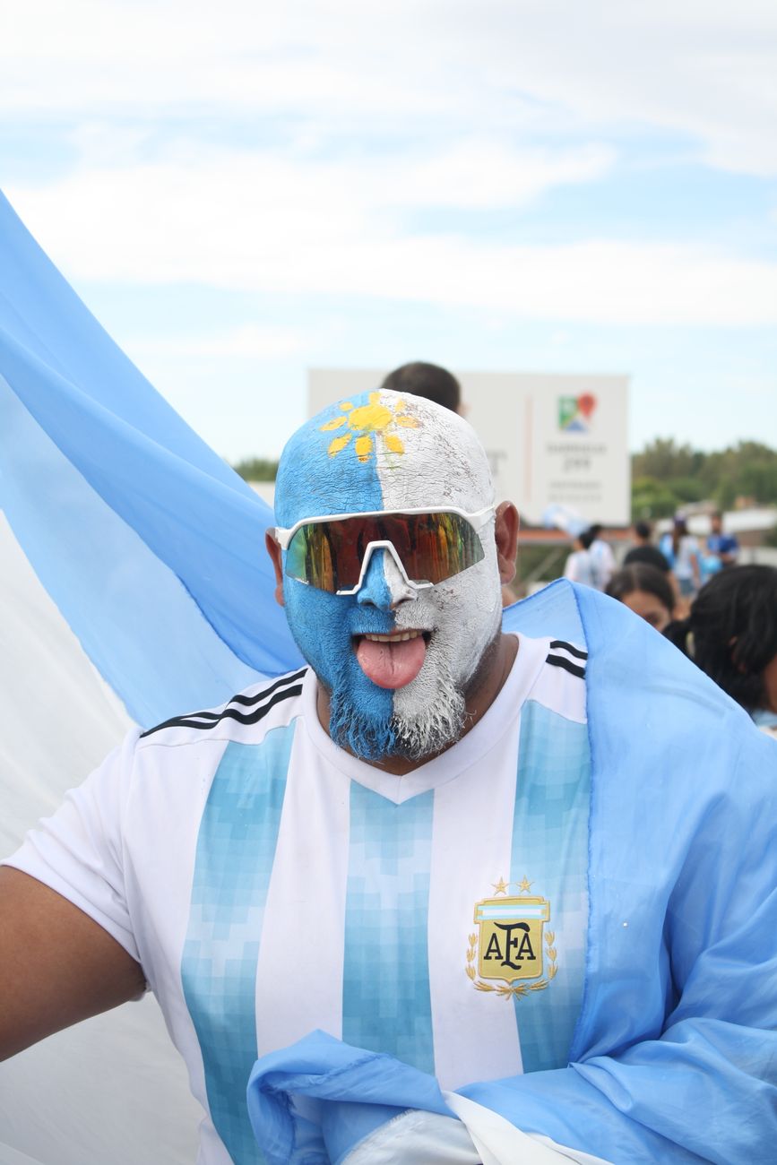 man draped with the argentinian flag