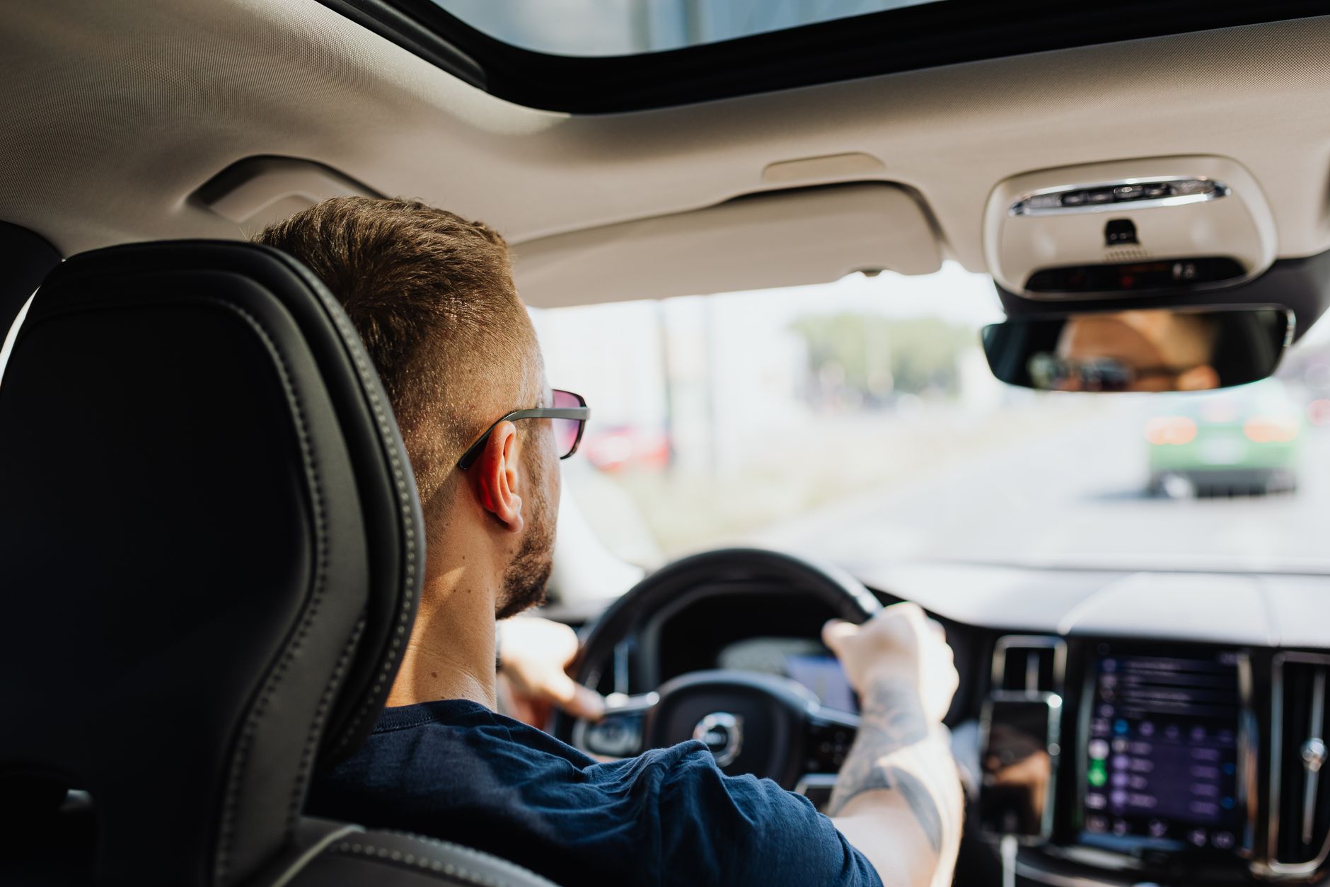 man driving a car